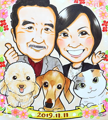 「あんめぐ」作の犬と猫も描いた夫婦の記念日似顔絵