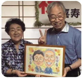 傘寿祝いのお客様と似顔絵